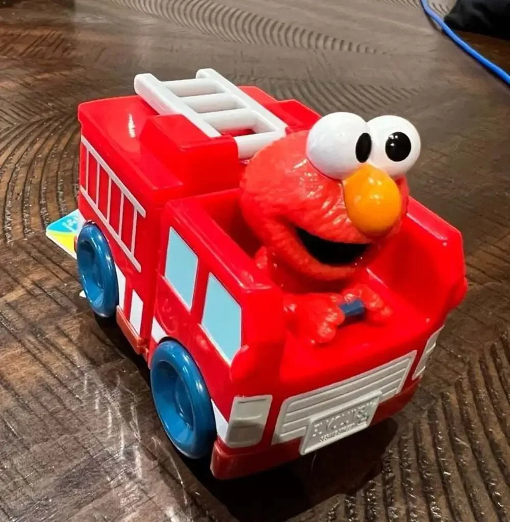 Sesame Street Twist & Pop Wheelies Elmo Fire Truck Vehicle Toy